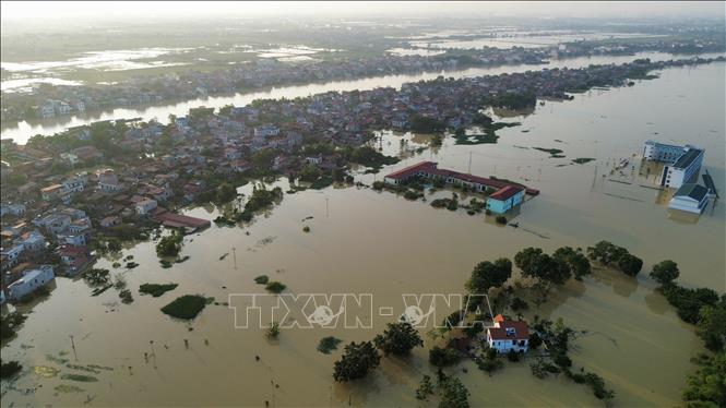 Một góc phường Vân Hà bị ngập sâu trong nước. Ảnh: Trần Việt - TTXVN 