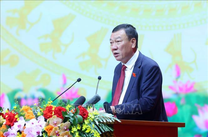 Đồng chí Đoàn Hồng Phong, Ủy viên Trung ương Đảng, Ủy viên Ban Thường vụ Đảng ủy Chính phủ, Tổng Thanh tra Chính phủ thay mặt Đoàn Chủ tịch trình bày báo cáo Thẩm tra tư cách đại biểu. Ảnh: Phạm Kiên - TTXVN