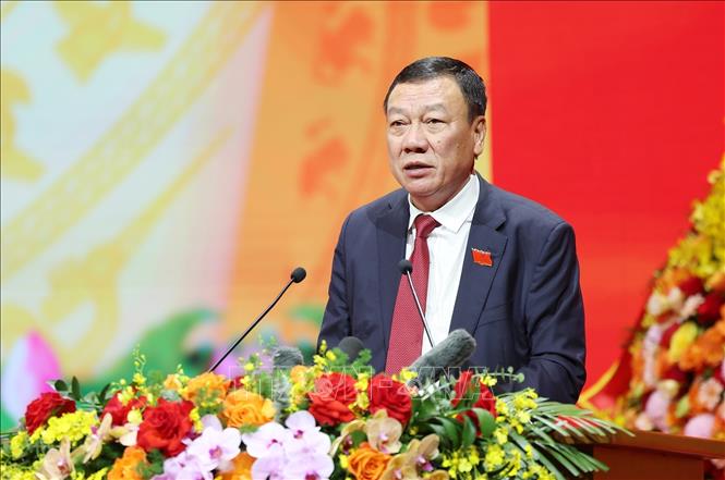Đồng chí Đoàn Hồng Phong, Ủy viên Trung ương Đảng, Ủy viên Ban Thường vụ Đảng ủy Chính phủ, Tổng Thanh tra Chính phủ thay mặt Đoàn Chủ tịch trình bày báo cáo Thẩm tra tư cách đại biểu. Ảnh: Dương Giang – TTXVN
