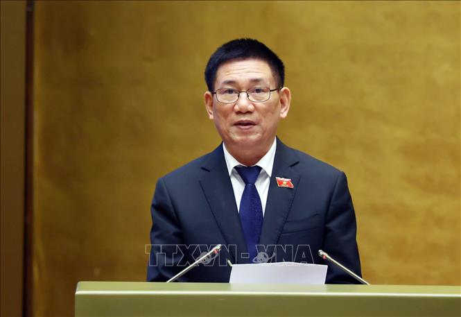 Phó Thủ tướng Hồ Đức Phớc trình bày Báo cáo về tình hình thực hiện ngân sách nhà nước năm 2025, dự toán ngân sách nhà nước, phương án phân bổ ngân sách trung ương năm 2026, Kế hoạch tài chính - ngân sách nhà nước 03 năm 2026 - 2028... Ảnh: Phạm Kiên - TTXVN