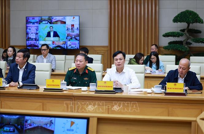 Các đại biểu tham dự cuộc làm việc về các giải pháp “phát triển đột phá nhà ở xã hội”. Ảnh: Dương Giang - TTXVN