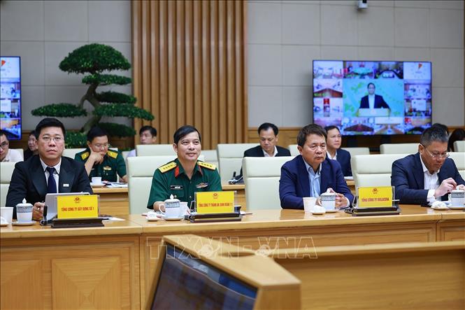 Các đại biểu tham dự cuộc làm việc về các giải pháp “phát triển đột phá nhà ở xã hội”. Ảnh: Dương Giang - TTXVN