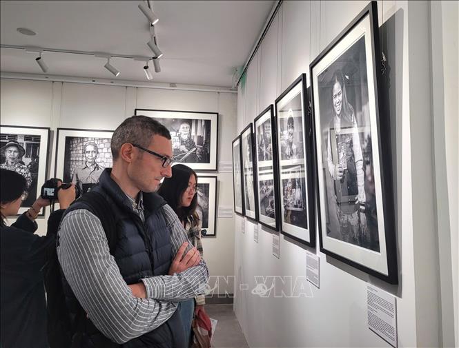 Visitors at the photo exhibition. VNA Photo