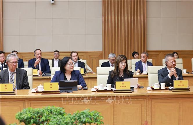 Đoàn lãnh đạo doanh nghiệp bán dẫn quốc tế tham dự buổi tiếp. Ảnh: Dương Giang-TTXVN
