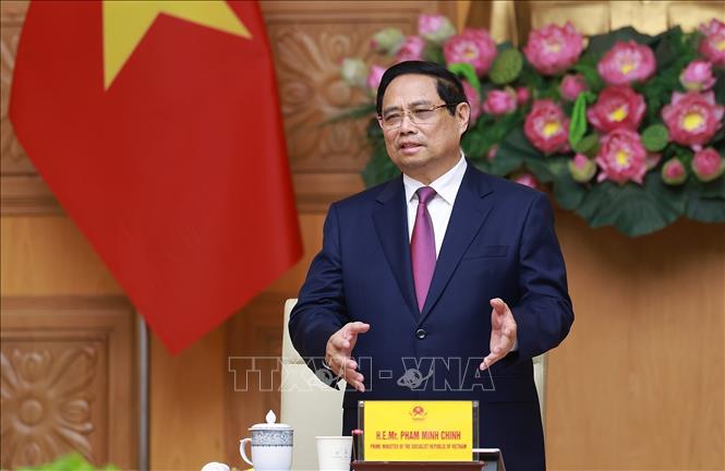 Thủ tướng Phạm Minh Chính tiếp đoàn lãnh đạo doanh nghiệp bán dẫn quốc tế. Ảnh: Dương Giang-TTXVN
