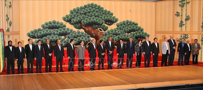 Chủ tịch nước Nguyễn Minh Triết với các trưởng đoàn dự Hội nghị Cấp cao APEC lần thứ 18 tại thành phố Yokohama (Nhật Bản), năm 2010. Ảnh: Nguyễn Khang – TTXVN