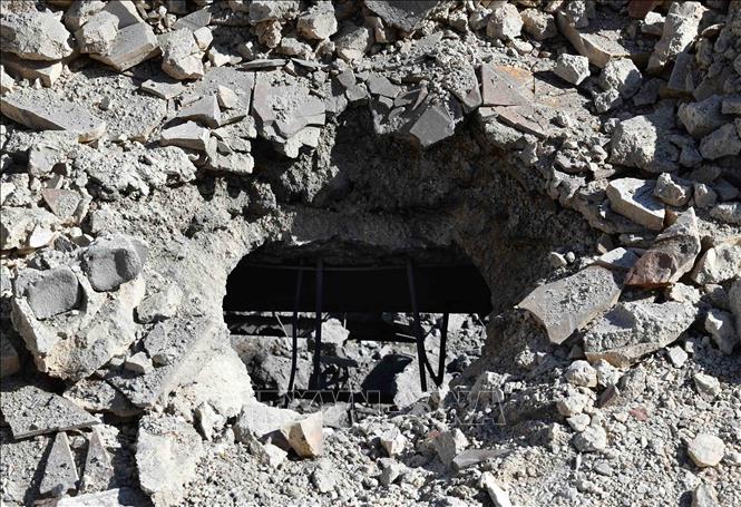 Toà nhà bị phá huỷ sau vụ không kích xuống Damascus, Syria. Ảnh: THX/TTXVN