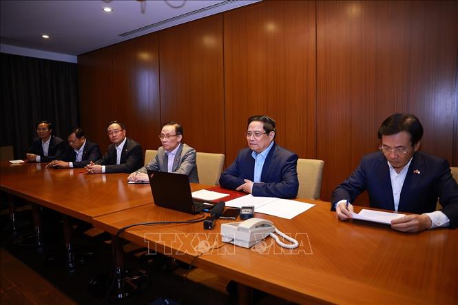 Thủ tướng Phạm Minh Chính họp trực tuyến đến các tỉnh, thành phố trong nước để triển khai các phương án cứu hộ, cứu nạn và khắc phục hậu quả thiên tai. Ảnh: Dương Giang-TTXVN
