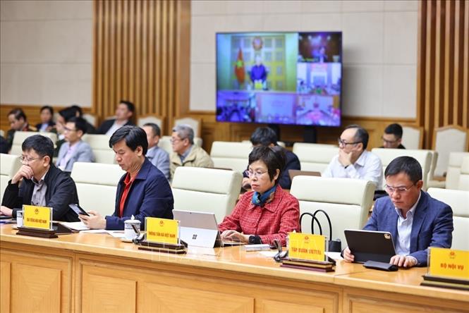 Các thành viên Ban Chỉ đạo Phòng thủ dân sự quốc gia tham dự cuộc họp tại điểm cầu trụ sở Chính phủ. Ảnh: Minh Đức – TTXVN

