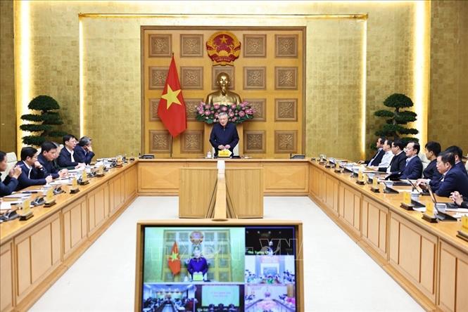 Phó Thủ tướng thường trực Chính phủ Nguyễn Hòa Bình dự tại điểm cầu trụ sở Chính phủ. Ảnh: Minh Đức – TTXVN