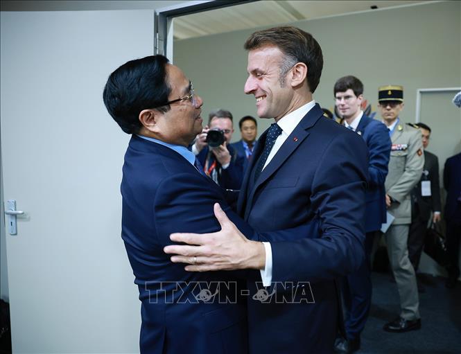 Thủ tướng Phạm Minh Chính gặp Tổng thống Pháp Emmanuel Macron. Ảnh: Dương Giang-TTXVN 