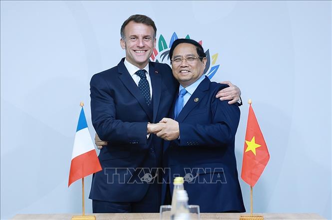 Thủ tướng Phạm Minh Chính gặp Tổng thống Pháp Emmanuel Macron. Ảnh: Dương Giang-TTXVN 
