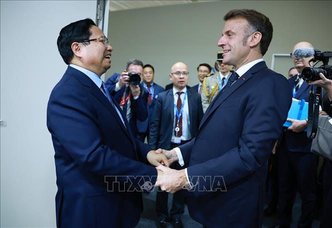 Thủ tướng Phạm Minh Chính gặp Tổng thống Pháp Emmanuel Macron. Ảnh: Dương Giang-TTXVN 