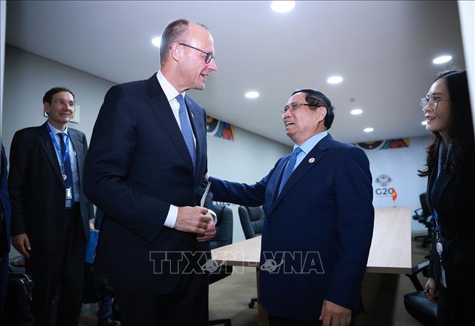 Thủ tướng Phạm Minh Chính gặp Thủ tướng Đức Friedrich Merz. Ảnh: Dương Giang-TTXVN