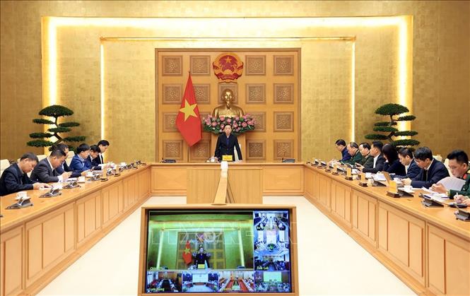 Phó Thủ tướng Trần Hồng Hà chủ trì họp triển khai ứng phó khẩn cấp cơn bão số 15. Ảnh: Tuấn Anh - TTXVN