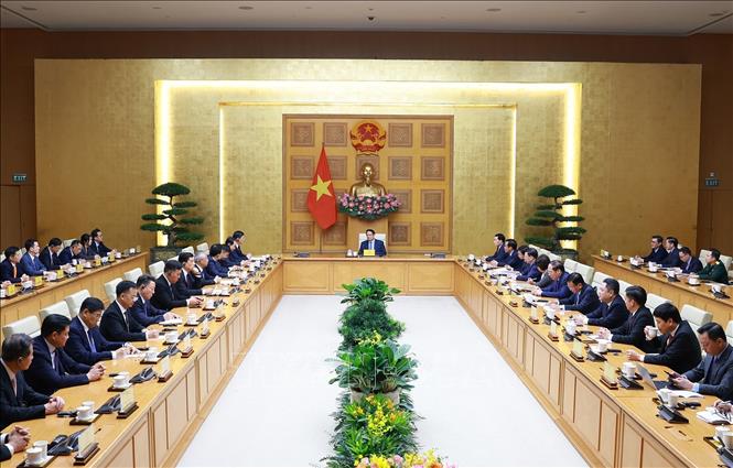Thủ tướng Phạm Minh Chính tiếp ông Vi Thao, Chủ tịch Khu tự trị dân tộc Choang Quảng Tây, Trung Quốc và đoàn doanh nghiệp. Ảnh: Dương Giang-TTXVN
