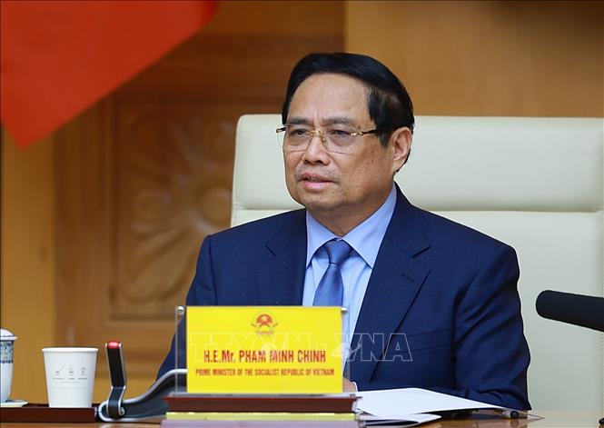 Prime Minister Pham Minh Chinh speaks at the working session. VNA Photo: Dương Giang
