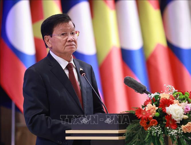 General Secretary of the Lao People’s Revolutionary Party and President of Laos Thongloun Sisoulith speaks at the banquet. VNA Photo: Thống Nhất