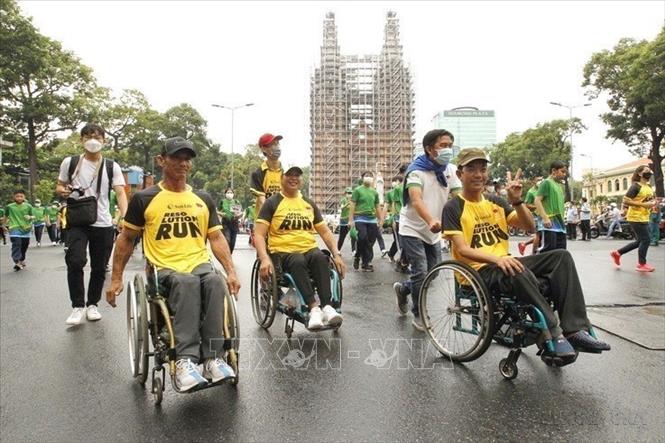 Các vận động viên khuyết tật thành phố Hồ Chí Minh tham gia Ngày chạy Olympic vì sức khỏe toàn dân năm 2022. Ảnh: Thanh Vũ - TTXVN