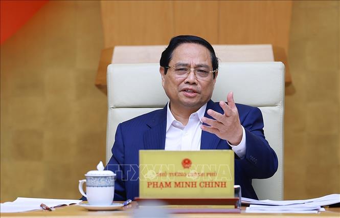 Prime Minister Pham Minh Chinh chairs the Government’s regular meeting on December 6. VNA Photo: Dương Giang