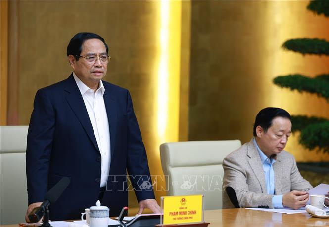 Thủ tướng Phạm Minh Chính chủ trì họp triển khai “Chiến dịch Quang Trung” thần tốc xây dựng nhà ở cho các gia đình bị thiệt hại do thiên tai tại miền Trung. Ảnh: Dương Giang-TTXVN 
