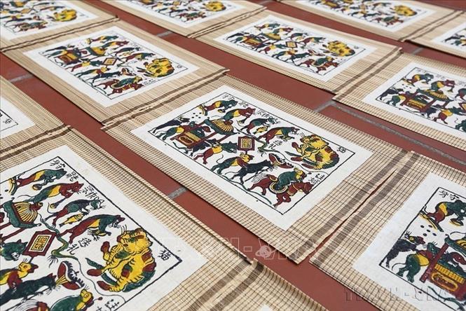 UNESCO ghi danh Nghề làm tranh dân gian Đông Hồ vào Danh sách Di sản văn hóa phi vật thể cần bảo vệ khẩn cấp. Đây là di sản thứ 17 của Việt Nam được UNESCO ghi danh vào các Danh sách Di sản Văn hóa Phi vật thể của UNESCO. Ảnh: TTXVN