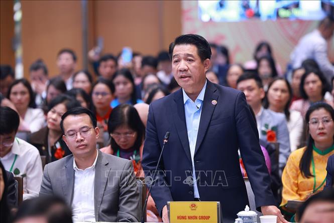 Đại diện doanh nghiệp sản xuất, kinh doanh sản phẩm nông nghiệp công nghệ cao phát biểu ý kiến. Ảnh: Dương Giang-TTXVN 
