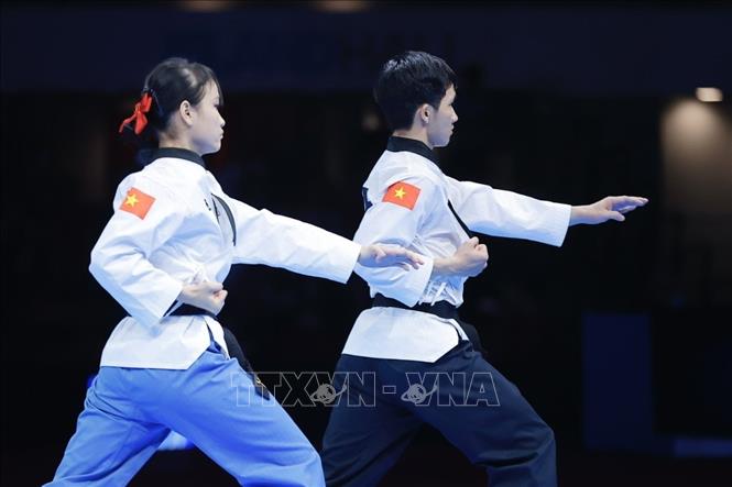 Đội Việt Nam thi đấu bán kết nội dung Quyền tiêu chuẩn gặp chủ nhà Thái Lan. Ảnh: Minh Quyết - PV TTXVN tại Thái Lan