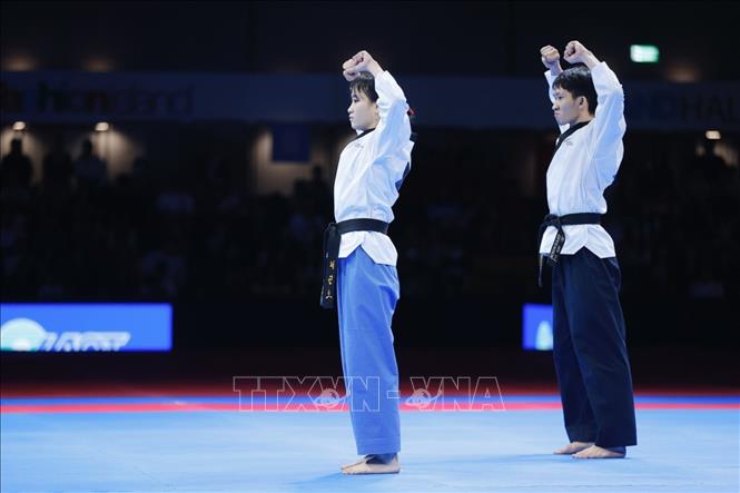 Đội Việt Nam thi đấu bán kết nội dung Quyền tiêu chuẩn gặp chủ nhà Thái Lan. Ảnh: Minh Quyết - PV TTXVN tại Thái Lan