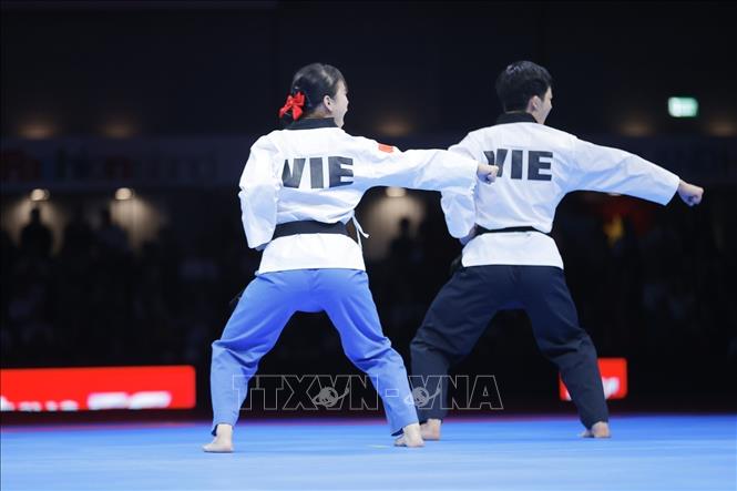 Đội Việt Nam thi đấu bán kết nội dung Quyền tiêu chuẩn gặp chủ nhà Thái Lan. Ảnh: Minh Quyết - PV TTXVN tại Thái Lan