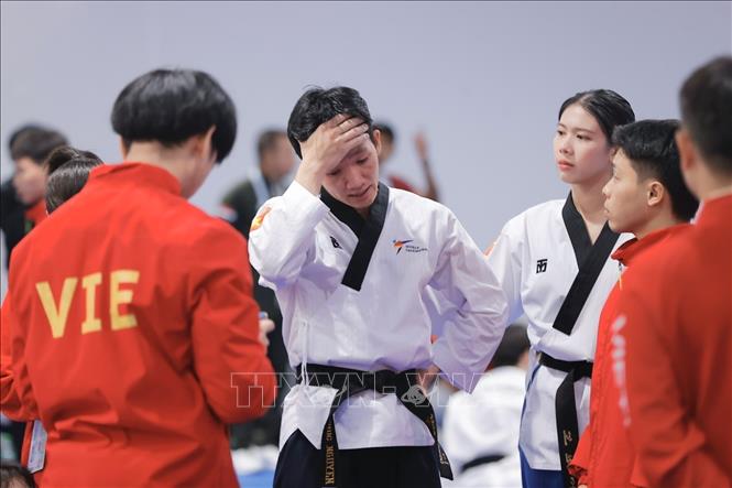 Đôi VĐV Việt Nam bị thua đối thủ trong trận chung kết gặp Singapore. Ảnh: Minh Quyết - PV TTXVN ừi Thái Lan