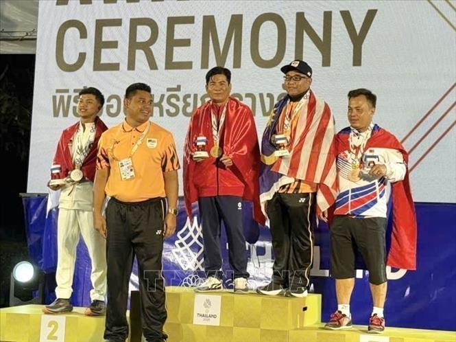 Nguyen Van Dung brings the first gold in petanque, which is the fourth gold on the day, for Vietnam. VNA/Photo by courtesy