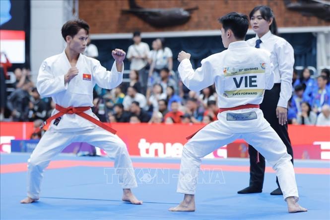 Phần thi nội dung biểu diễn của hai VĐV Việt Nam Trần Hữu Tuấn và Nguyễn Thanh Trà. Ảnh: Minh Quyết - PV TTXVN tại Thái Lan
