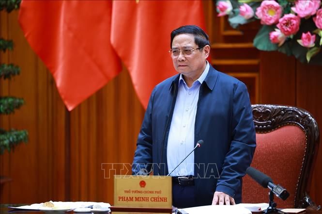 Thủ tướng Phạm Minh Chính chủ trì cuộc họp với lãnh đạo tỉnh Quảng Trị về xây dựng nhà ở cho các gia đình bị thiệt hại do thiên tai tại Quảng Trị. Ảnh: Dương Giang-TTXVN
