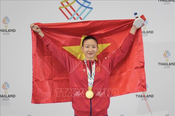 VĐV Hoàng Thị Mỹ Tâm thi đấu xuất sắc, giành HCV ở hạng cân 61 kg nữ. Ảnh: TTXVN phát