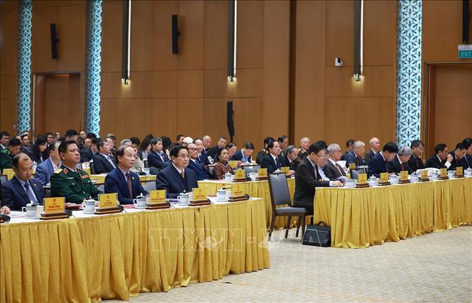 Thủ tướng Phạm Minh Chính với các đại biểu dự Lễ kỷ niệm 50 năm thành lập Uỷ ban Biên giới quốc gia. Ảnh: Dương Giang - TTXVN
