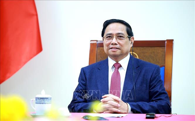 Thủ tướng Phạm Minh Chính điện đàm với Thủ tướng Singapore Lawrence Wong. Ảnh: Dương Giang-TTXVN