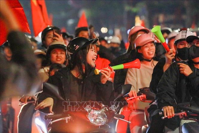 Football fans in Hanoi celebrate on the streets. VNA Photo 