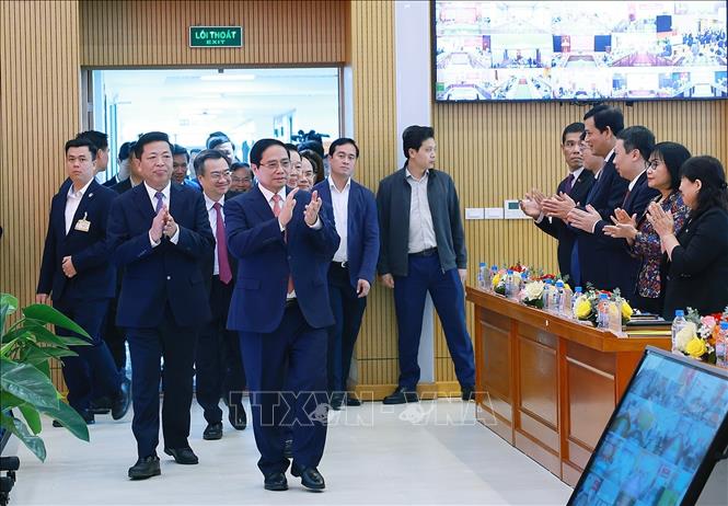 Thủ tướng Phạm Minh Chính đến dự Hội nghị Tổng kết công tác năm 2025 và triển khai nhiệm vụ năm 2026 của Bộ Xây dựng. Ảnh: Dương Giang-TTXVN
