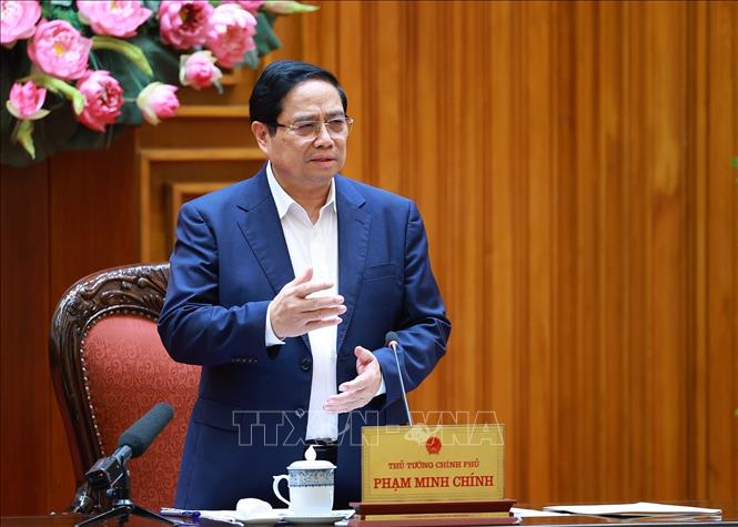 Thủ tướng Phạm Minh Chính làm việc với lãnh đạo Bộ Quốc phòng về phát triển công nghiệp quốc phòng. Ảnh: Dương Giang-TTXVN
