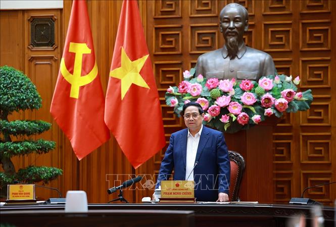 Thủ tướng Phạm Minh Chính làm việc với lãnh đạo Bộ Quốc phòng về phát triển công nghiệp quốc phòng. Ảnh: Dương Giang-TTXVN
