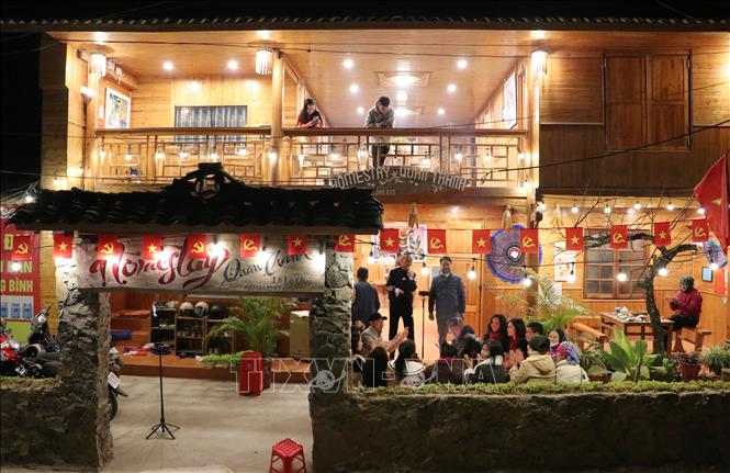Tourists experience a night at Lo Lo Chai village, one of the world's best tourism villages, in Lung Cu commune. VNA Photo: Đức Thọ