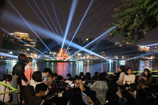 Hoan Kiem Lake in Hanoi's center lights up to welcome the New Year. VNA Photo