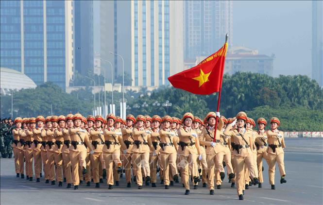 Khối nữ Cảnh sát giao thông tham gia duyệt đội ngũ tại buổi lễ. Ảnh: Phạm Kiên - TTXVN