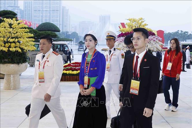 Delegates arrive for the opening session of the 14th National Congress of the Communist Party of Vietnam. Photo: VNA
