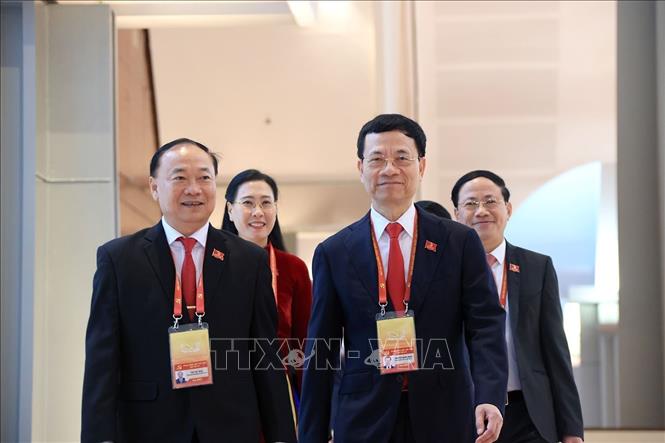 Các đại biểu đến dự phiên khai mạc Đại hội XIV của Đảng. Ảnh: TTXVN