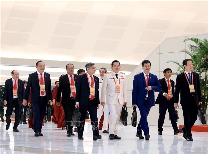Delegates arrive for the opening session of the 14th National Congress of the Communist Party of Vietnam. Photo: VNA