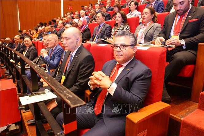 Đại biểu quốc tế tham dự phiên khai mạc Đại hội XIV của Đảng. Ảnh: TTXVN