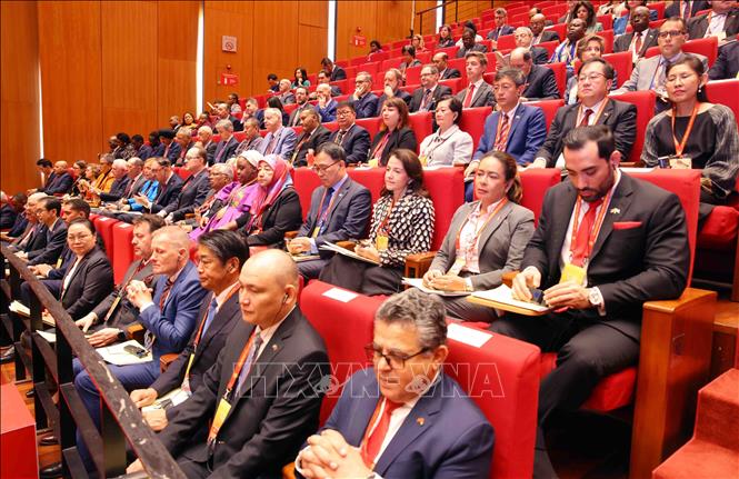 Các đại biểu quốc tế dự phiên khai mạc Đại hội XIV của Đảng. Ảnh: TTXVN