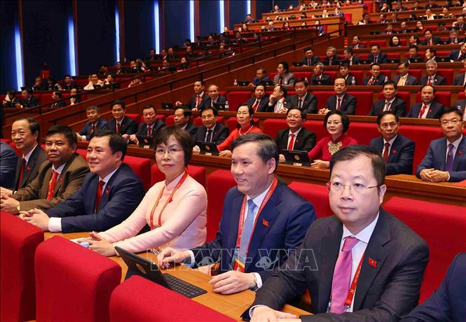 Đoàn đại biểu Đảng bộ Chính phủ tham dự phiên khai mạc Đại hội XIV của Đảng. Ảnh: TTXVN